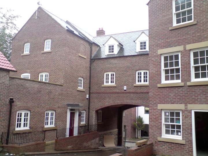 Completed building scheme by W J M Quigley Ltd, showing new brickwork and roofing